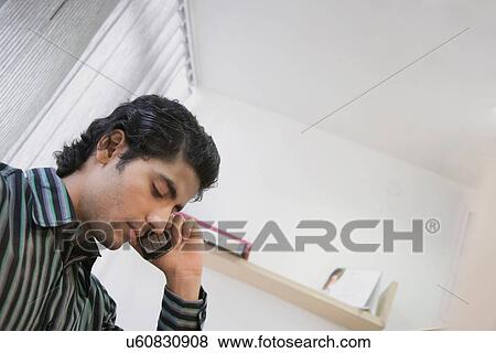 Talking on the phone View Large Photo Image Stock Photo - Talking on the phone . Fotosearch