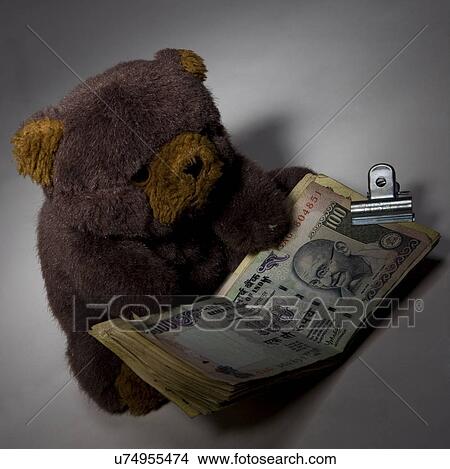 Picture - Teddy bear with money . Fotosearch