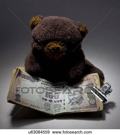 Stock Photo - Teddy bear with money . Fotosearch