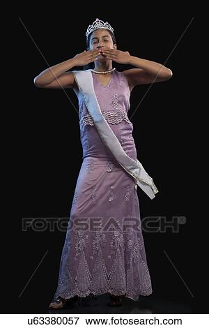 Teenage beauty queen blowing a kiss View Large Photo Image Stock Photo - Teenage beauty queen blowing a kiss . Fotosearch