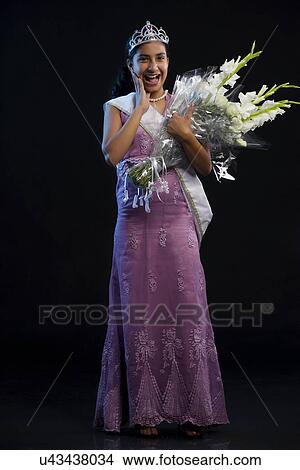 Picture - Teenage beauty queen with a bouquet . Fotosearch