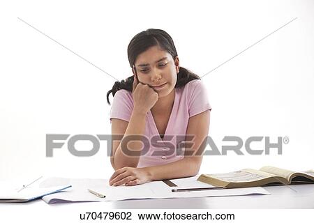 Stock Image - Teenage girl in deep thought . Fotosearch
