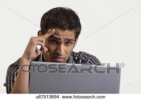 Tensed at work View Large Photo Image Picture - Tensed at work . Fotosearch