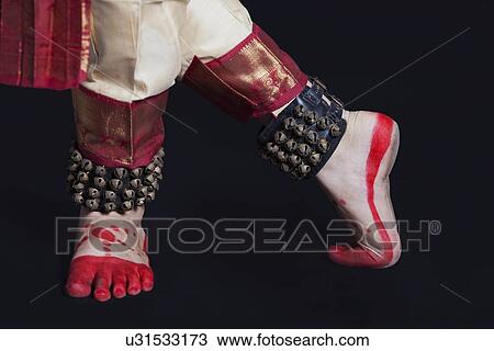 Traditional dancer's feet performing Bharatanatyam on black background View Large Photo Image Stock Image - Traditional dancer's feet performing Bharatanatyam on black background. Fotosearch