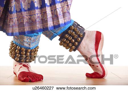 Traditional dancer's feet performing Bharatanatyam over white background View Large Photo Image Stock Photo - Traditional dancer's feet performing Bharatanatyam over white background. Fotosearch