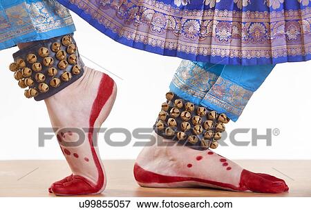 Stock Photo - Traditional dancer's feet performing Bharatanatyam over white background. Fotosearch