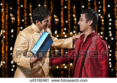Two men greeting each other View Large Photo Image Stock Image - Two men greeting each other. Fotosearch