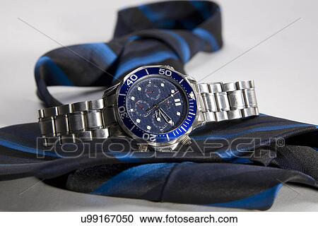Watch along with blue tie View Large Photo Image Stock Image - Watch along with blue tie . Fotosearch