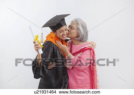 Picture - Woman at granddaughter's graduation ceremony. Fotosearch