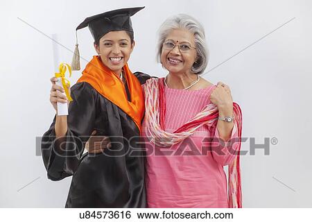 Woman at granddaughter's graduation ceremony View Large Photo Image Stock Photograph - Woman at granddaughter's graduation ceremony. Fotosearch