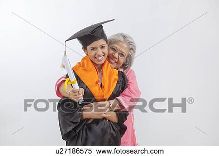 Woman at granddaughter's graduation ceremony View Large Photo Image Stock Photography - Woman at granddaughter's graduation ceremony. Fotosearch