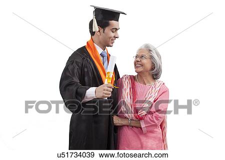 Stock Photo - Woman at grandson's graduation ceremony. Fotosearch