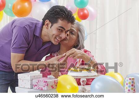 Woman celebrating birthday with grandson View Large Photo Image Stock Photo - Woman celebrating birthday with grandson. Fotosearch