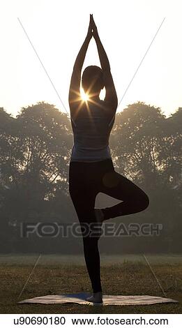 Stock Image - Woman doing yoga practice . Fotosearch