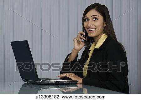 Stock Image - Woman Executive at work . Fotosearch