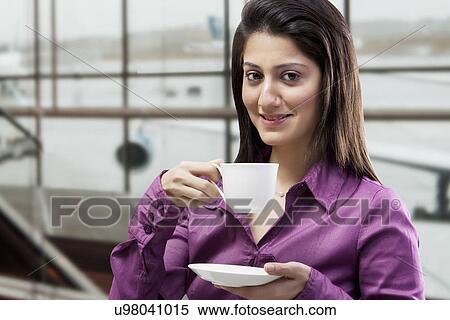 Woman having a cup of coffee View Large Photo Image Stock Photography - Woman having a cup of coffee . Fotosearch