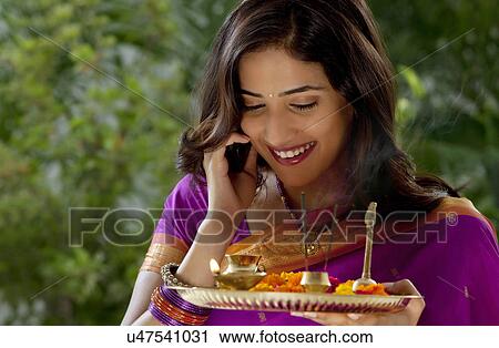 Stock Image - Woman holding a tray . Fotosearch
