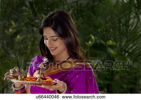Stock Photograph - Woman holding a tray . Fotosearch