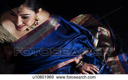 Stock Photo - Woman in a blue saree . Fotosearch