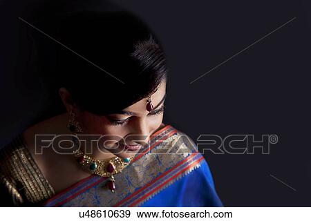 Woman in a blue saree View Large Photo Image Stock Photo - Woman in a blue saree . Fotosearch