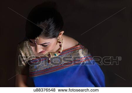 Stock Photo - Woman in a blue saree . Fotosearch