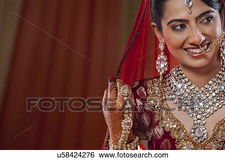 Woman in wedding dress looking away View Large Photo Image Stock Photograph - Woman in wedding dress looking away . Fotosearch