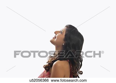 Stock Photograph - Woman looking up. Fotosearch