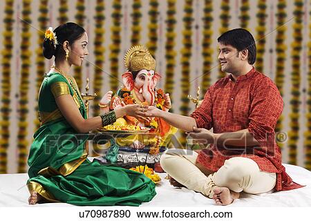 Woman offering man sweets View Large Photo Image Stock Image - Woman offering man sweets . Fotosearch