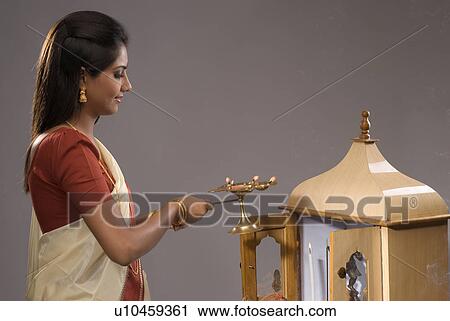 Woman offering prayers View Large Photo Image Stock Image - Woman offering prayers . Fotosearch