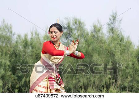 Woman performing Bihu dance View Large Photo Image Stock Image - Woman performing Bihu dance . Fotosearch