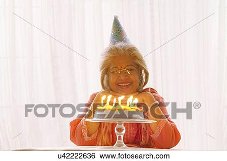 Woman posing with her birthday cake View Large Photo Image Stock Photograph - Woman posing with her birthday cake. Fotosearch