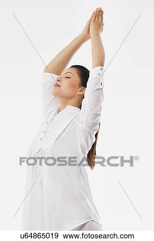 Woman practicing mountain pose View Large Photo Image Stock Photo - Woman practicing mountain pose . Fotosearch