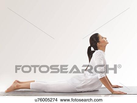 Picture - Woman practicing yoga - upward dog . Fotosearch