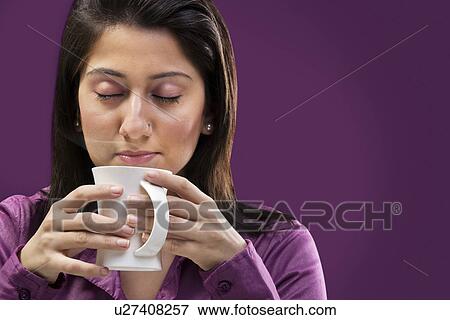 Stock Photo - Woman smelling the coffee . Fotosearch