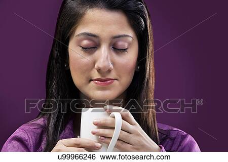 Woman smelling the coffee View Large Photo Image Stock Photograph - Woman smelling the coffee . Fotosearch