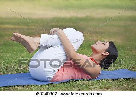 Woman stretching in lawn View Large Photo Image Stock Image - Woman stretching in lawn . Fotosearch
