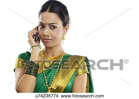Woman talking on a mobile phone View Large Photo Image Picture - Woman talking on a mobile phone . Fotosearch