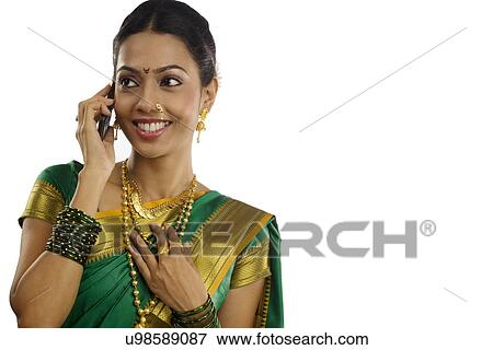 Stock Photo - Woman talking on a mobile phone . Fotosearch