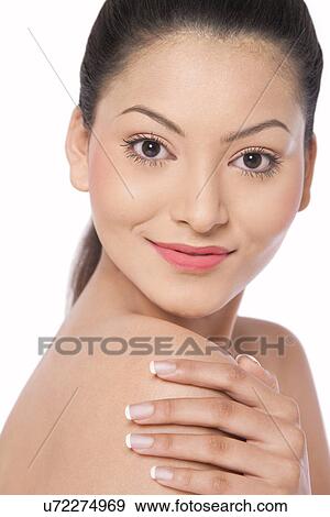 Woman touching her shoulder View Large Photo Image Stock Photo - Woman touching her shoulder . Fotosearch