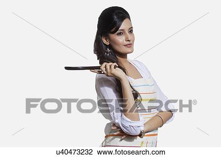 Stock Image - Woman with a cooking utensil. Fotosearch