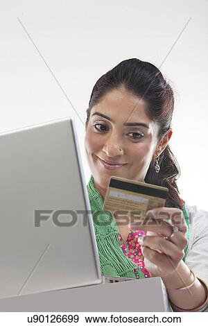 Stock Photo - Woman with a credit card . Fotosearch