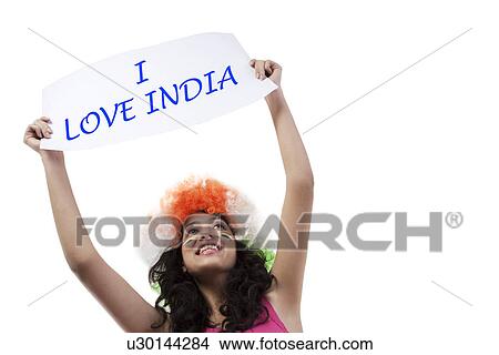 Woman with a wig holding up a placard View Large Photo Image Picture - Woman with a wig holding up a placard . Fotosearch
