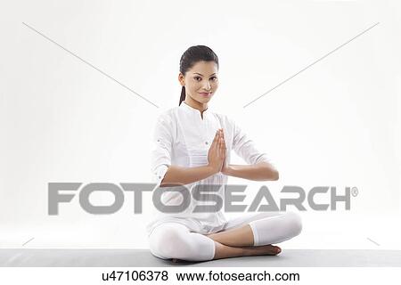Woman with hands joint doing yoga View Large Photo Image Stock Photo - Woman with hands joint doing yoga . Fotosearch