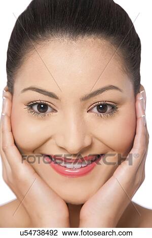 Stock Image - Woman with hands on cheeks . Fotosearch