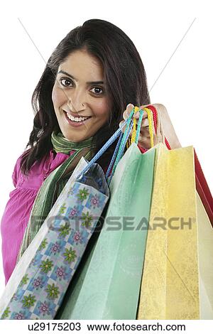 Stock Image - Woman with shopping bags . Fotosearch