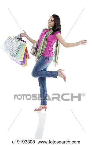 Woman with shopping bags View Large Photo Image Stock Photo - Woman with shopping bags . Fotosearch