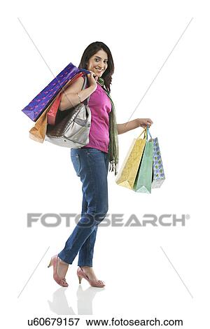 Woman with shopping bags View Large Photo Image Stock Photo - Woman with shopping bags . Fotosearch