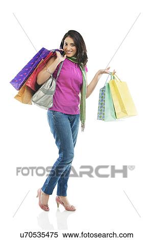 Stock Photography - Woman with shopping bags . Fotosearch