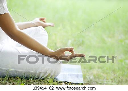 Woman's hand in a meditative gesture View Large Photo Image Stock Image - Woman's hand in a meditative gesture . Fotosearch