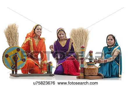 Women with a spinning wheel and a butter churner  View Large Photo Image Stock Photograph - Women with a spinning wheel and a butter churner . Fotosearch